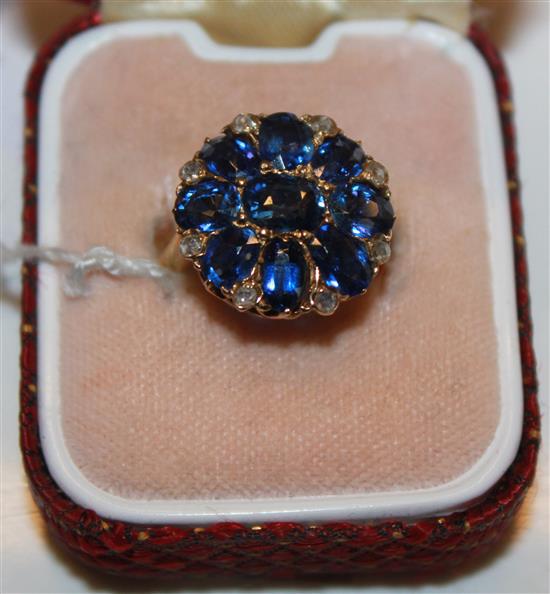 An 18ct gold sapphire and rose cut diamond cluster ring, size I.(-)